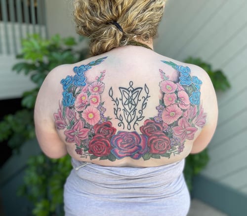 A colorful floral arrangement with roses and ornamental design on the back, featuring vibrant colors and intricate details — by Sandra Price, los angeles