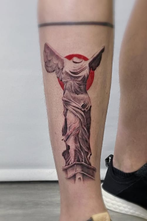 A realistic depiction of the Nike of Samothrace statue on the calf, featuring detailed shading in black and grey with a red circular background — by Jian Liang, los angeles
