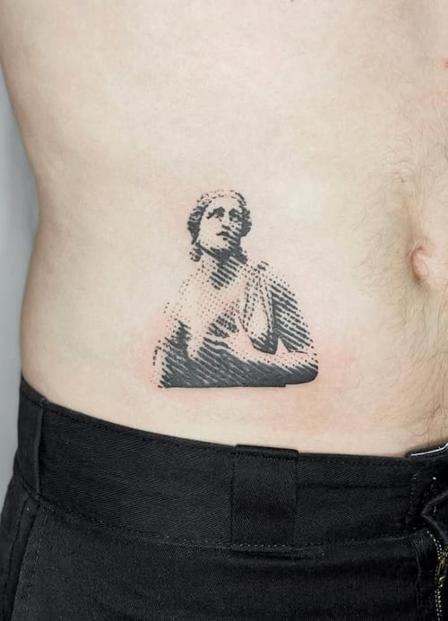 A small black and grey dotwork portrait tattoo on the rib, depicting a classical statue-like figure with intricate shading — by Level tattoo, los angeles