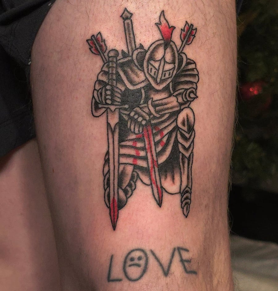 A bold black and grey tattoo of a knight in armor with swords on the thigh, done in a neo-traditional style — by Miguel ANGELO, los angeles
