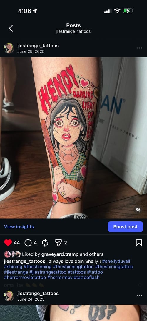 A colorful neo-traditional tattoo of Shelly Duvall holding a bat, with a quote, on the leg. The design features bold outlines and vibrant colors — by Jessica Linden, los angeles