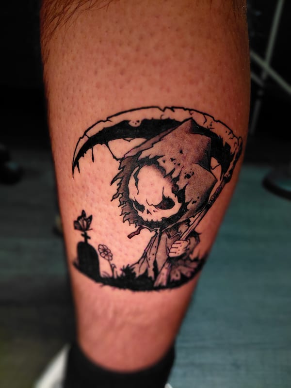 illustrative blackwork tattoo of a small grim reaper with a scythe in a graveyard with a butterfly on the calf by anoetic.designs, a tattoo artist in redlands, california