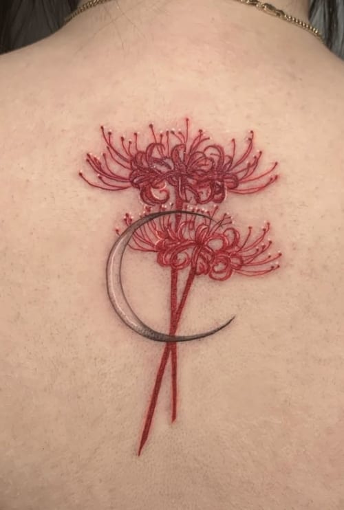 A delicate fine line tattoo on the back featuring red flowers and a crescent moon, with a soft and elegant design — by Shelby Bianco, los angeles