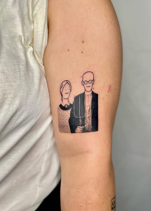A minimalist black and grey tattoo of a portrait on the upper arm, featuring simple linework and shading — by Level tattoo, los angeles