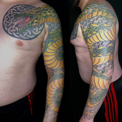 A bold and colorful Japanese dragon tattoo with Celtic elements covering the full sleeve — by Sandra Price, los angeles