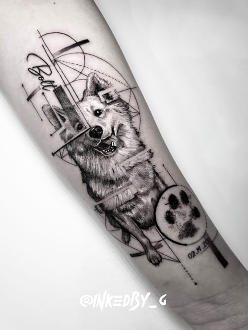 A black and grey geometric realism tattoo of a dog on the forearm, featuring intricate linework and shading with a paw print and date — by INKEDBy_G, los angeles