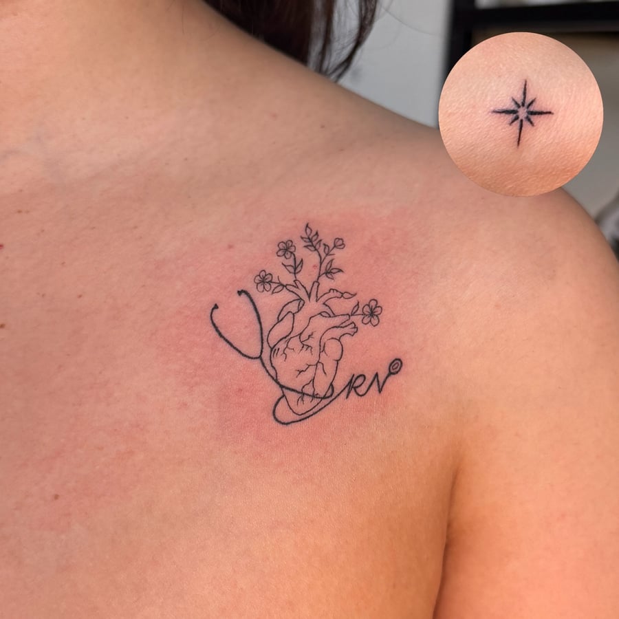 A delicate fine line tattoo of an anatomical heart with flowers on the shoulder, done in black ink — by NJ TATTOOZ, los angeles