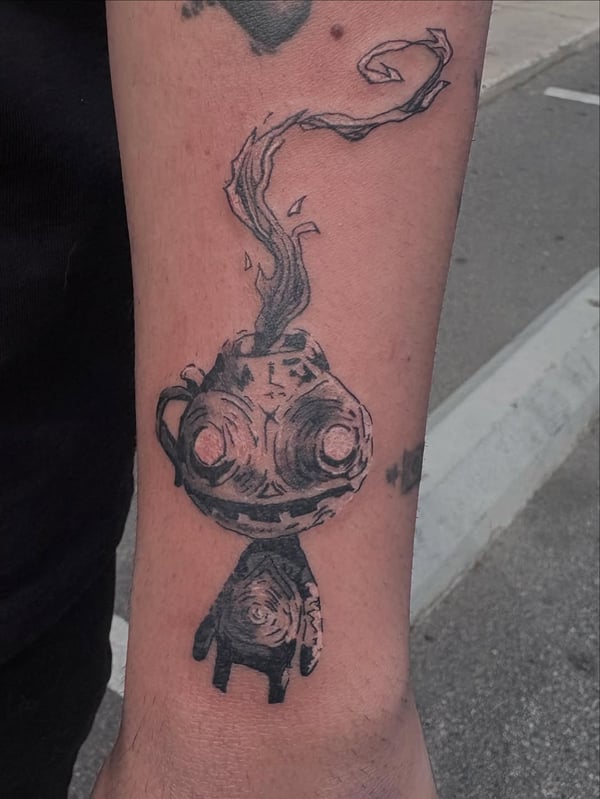 An abstract black and grey creature tattoo on the forearm with a dark and graphic style — by Hannah , fountain valley, ca