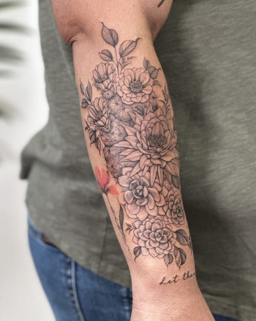 A delicate black and grey floral bouquet tattoo on the forearm with intricate detailing — by Melanie Benoit, los angeles