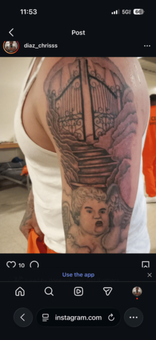 A black and grey tattoo on the upper arm depicting an angel with clouds and a stairway leading to gates, rendered in a realistic style — by christopher diaz, los angeles