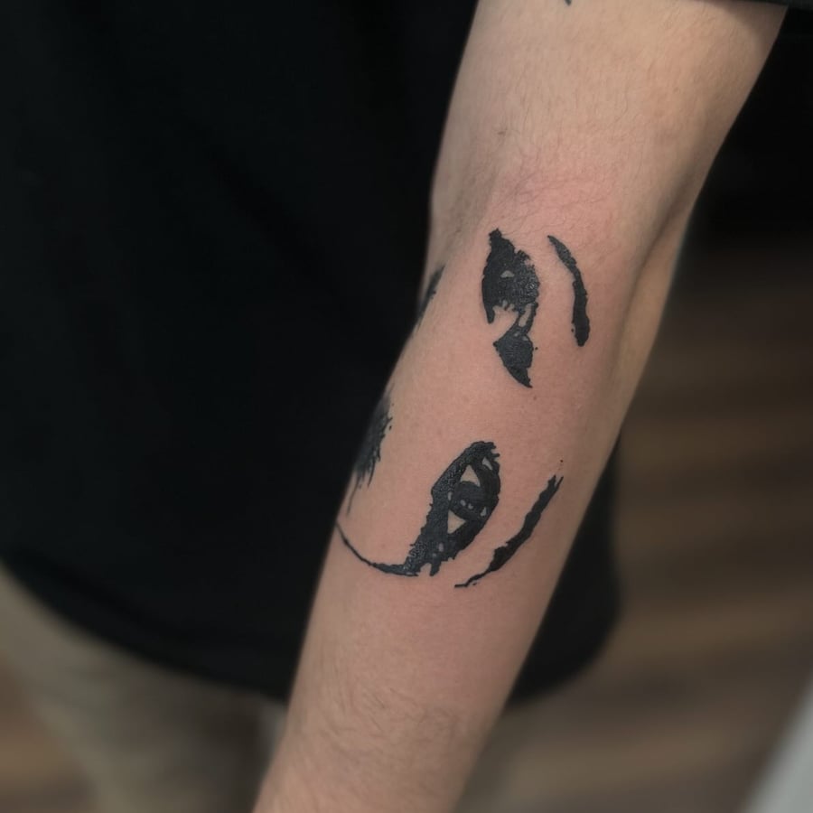 An abstract blackwork eye design tattoo on the forearm with bold black ink — by Maddie Ramirez, los angeles