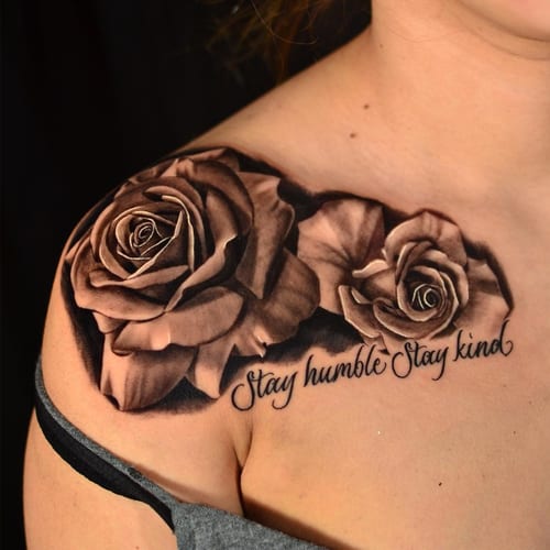 A realistic black and grey tattoo of roses with script lettering on the shoulder, featuring detailed shading and delicate lines — by Johnny Ayala, los angeles