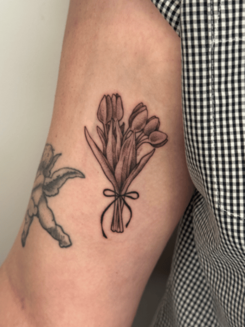 fine line bouquet of tulips tattoo — by Samantha Wilks, los angeles