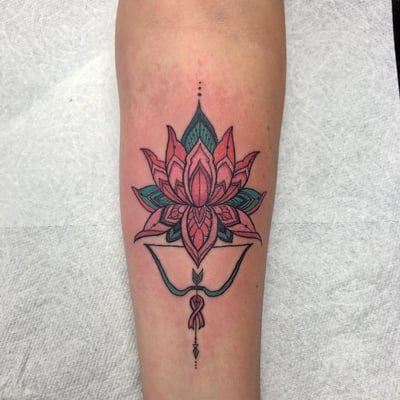 A colorful ornamental lotus flower tattoo on the forearm with intricate linework and delicate details — by Sandra Price, los angeles