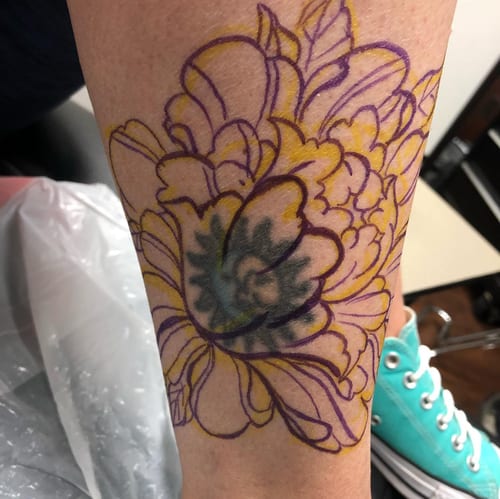 A colorful floral outline tattoo on the forearm with delicate linework and vibrant colors — by Sandra Price, los angeles