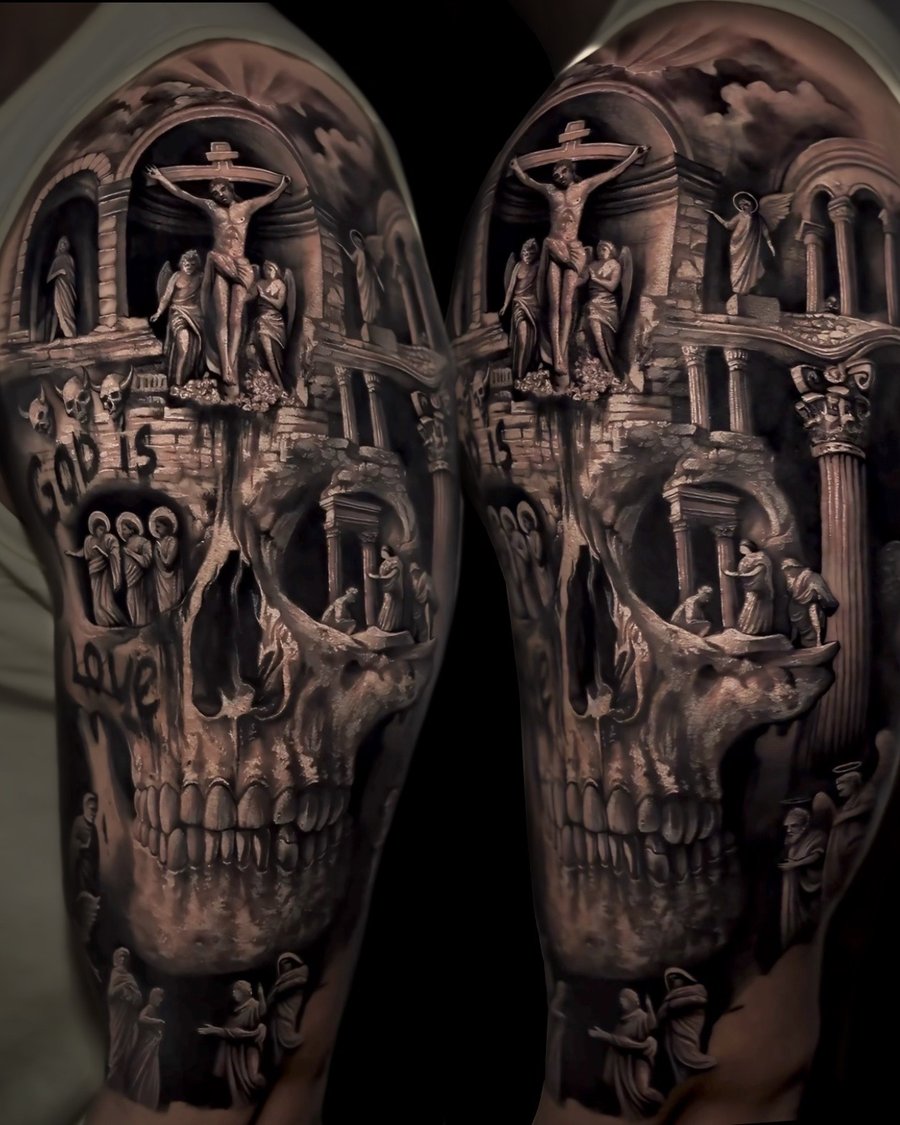 A detailed black and grey tattoo of a skull with a religious scene featuring Jesus on the cross, covering the arm — by Vladimir Kozachenko, los angeles