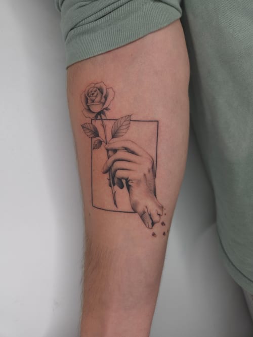fine line hand holding a rose tattoo — by ashynucklestattoo, los angeles