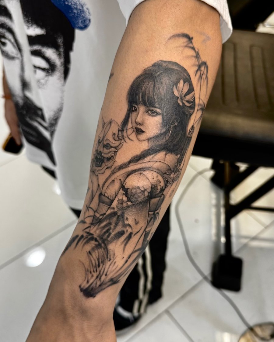 A detailed black and grey realism tattoo of a woman holding a sword on the forearm, featuring intricate shading and fine lines — by otaybeatdown, los angeles