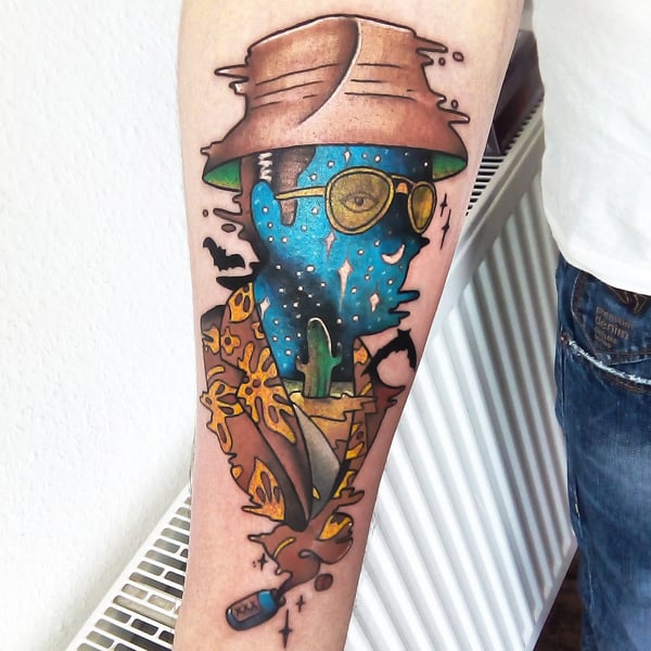 A colorful abstract portrait tattoo on the forearm featuring a figure with a hat and sunglasses in a bold illustrative style — by Samuel Connelly, san diego, ca