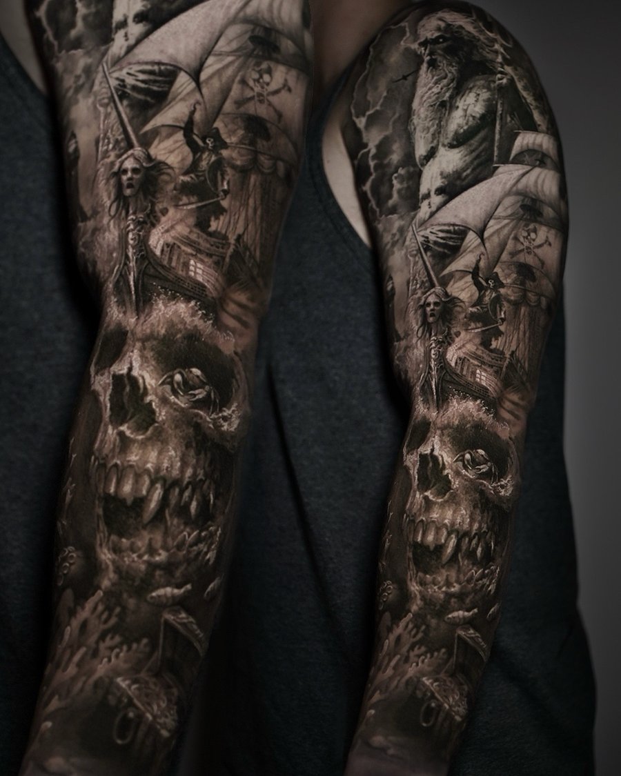 A detailed black and grey tattoo featuring a pirate ship and skull on a full sleeve, with realistic shading and ocean elements — by Vladimir Kozachenko, los angeles