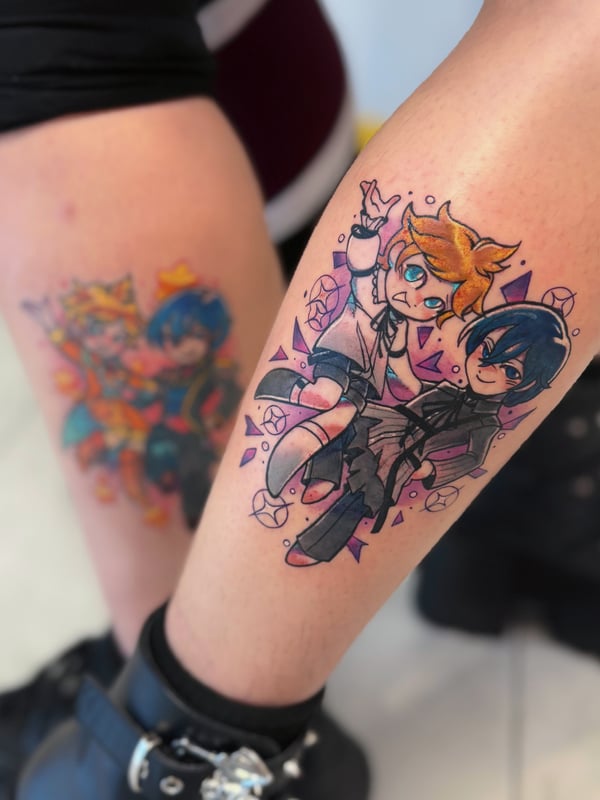 A colorful anime-style tattoo on the calf featuring two cartoon characters with vibrant colors and dynamic poses — by Tweetwee, west covina, ca