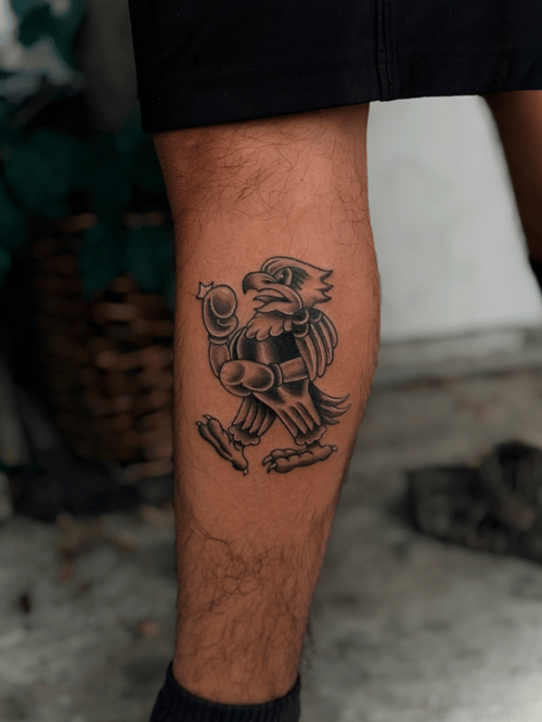 black & grey eagle with boxing gloves tattoo — by Engram, los angeles