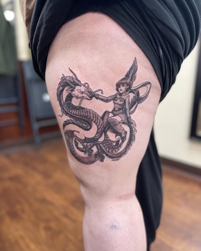 An anime-style tattoo featuring a woman interacting with a dragon, done in black and grey on the thigh — by Sandra Price, los angeles