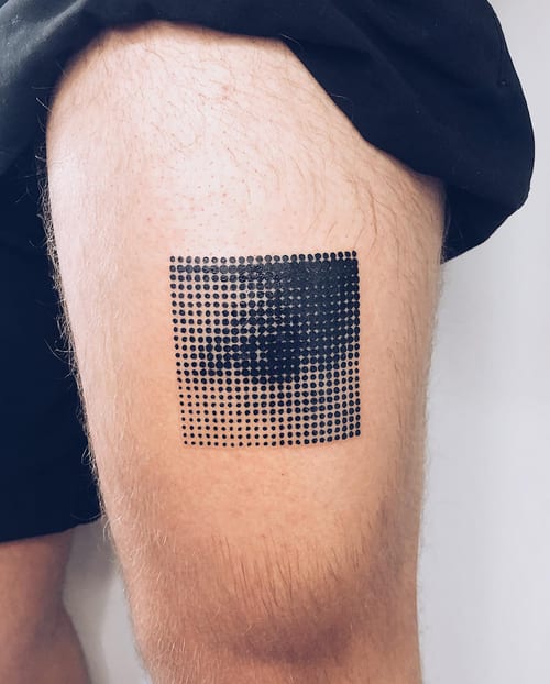 A graphic black and grey dotwork tattoo of an eye on the thigh, featuring an abstract design with a pixelated effect — by Level tattoo, los angeles