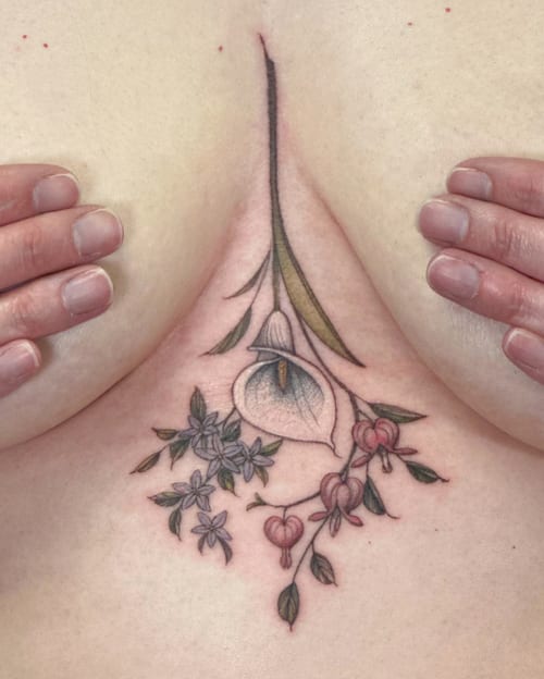 A delicate floral arrangement tattoo on the chest featuring fine line work and soft colors — by Melanie Benoit, los angeles