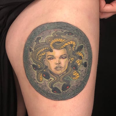 A colorful neo-traditional Medusa tattoo on the thigh, featuring snakes and an ornate design — by Sandra Price, los angeles