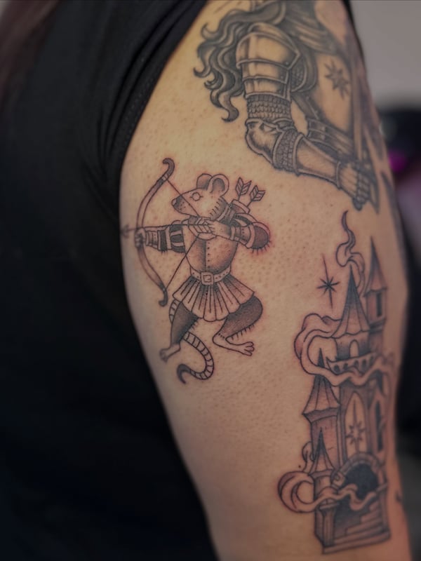 A traditional black and grey mouse archer on the upper arm — by Maddie Ramirez, palm desert, ca