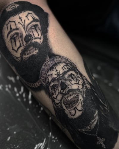 A black and grey tattoo featuring two clown portraits with intricate face paint — by Maddie Ramirez, los angeles