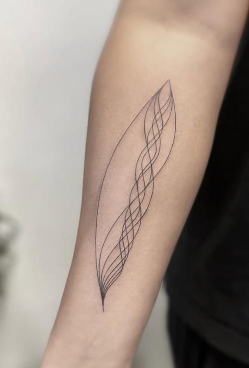 A minimalist linework tattoo on the forearm featuring an abstract, flowing design in black ink — by Jian Liang, los angeles