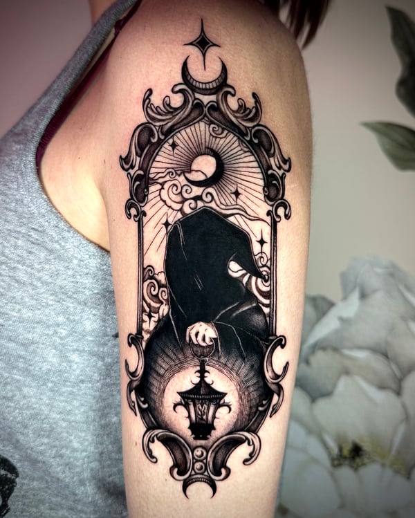 blackwork hooded figure with lantern tattoo — by emily, rahway