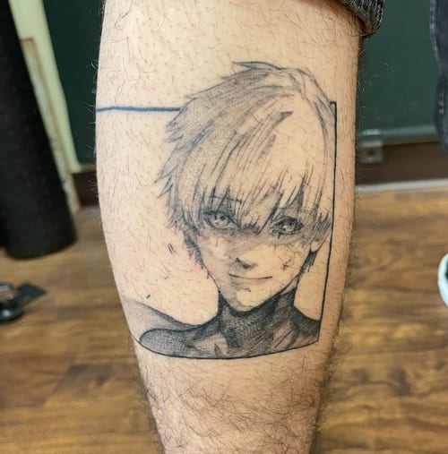 A black and grey anime character portrait tattoo on the calf with a graphic style — by Sandra Price, los angeles