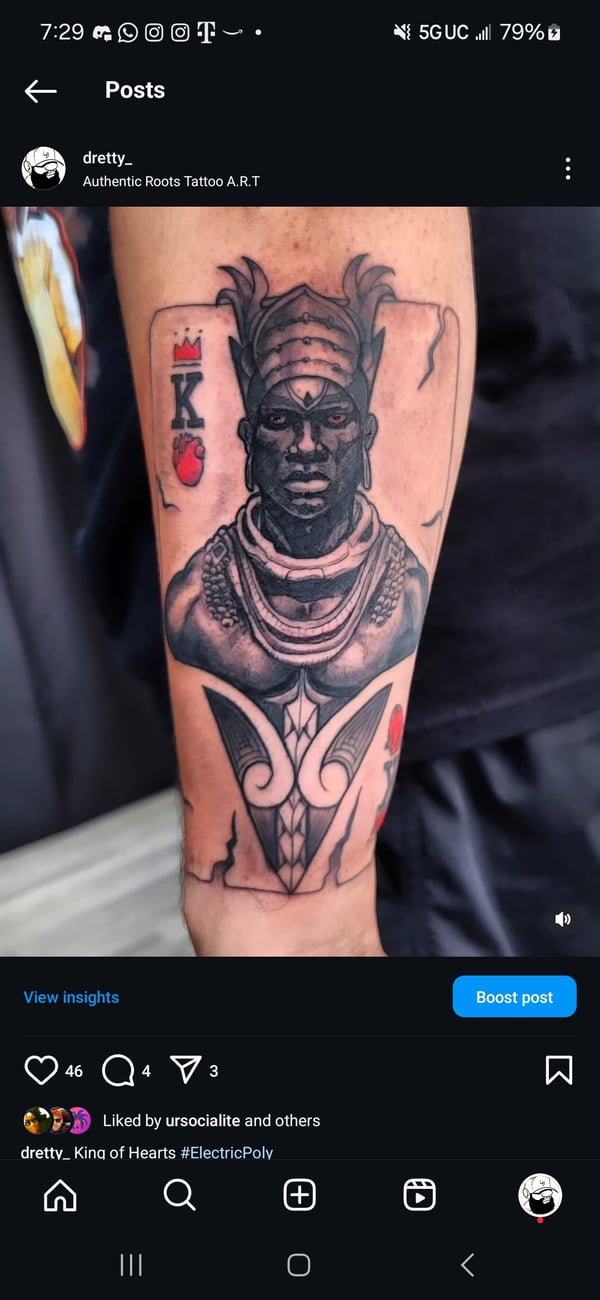 A black and grey illustrative tattoo on the forearm depicting a stylized portrait of a king with intricate details and bold lines — by Dretty, long beach, ca