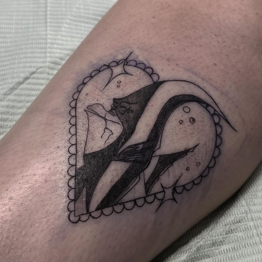 A black and grey shark tattoo in a heart shape with fine line details — by Maddie Ramirez, los angeles