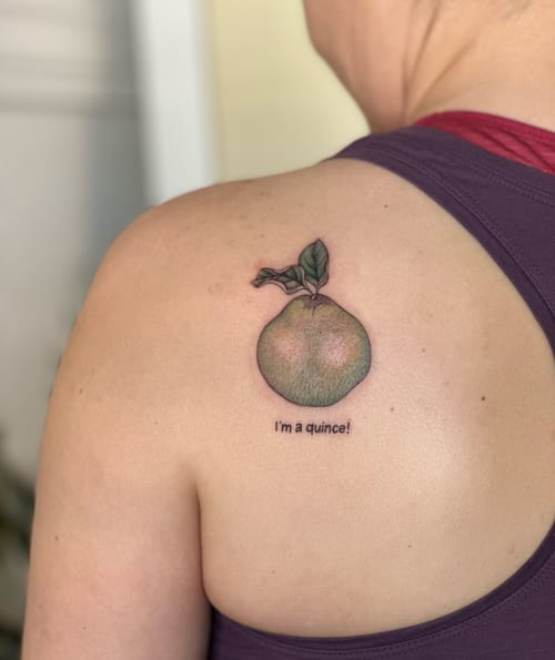 A whimsical color tattoo of a quince fruit with text on the back, featuring a minimalist and illustrative style — by Melanie Benoit, los angeles