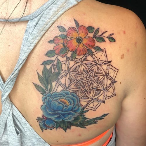 A colorful floral mandala tattoo on the shoulder, featuring detailed flowers and intricate patterns — by Sandra Price, los angeles