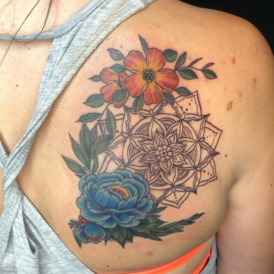 A colorful floral mandala tattoo on the shoulder, featuring detailed flowers and intricate patterns — by Sandra Price, los angeles