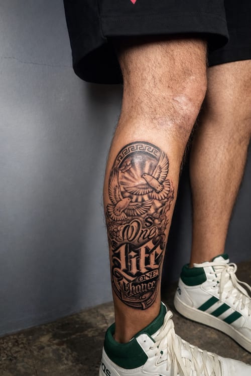black & grey eagle with lettering tattoo — by Edgar Armas Rodriguez, los angeles