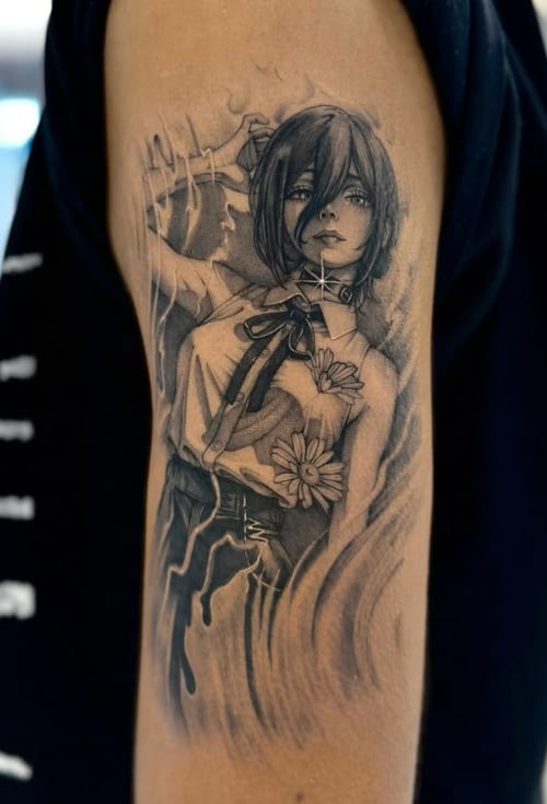 A black and grey anime-style tattoo of a woman with flowers on the upper arm, featuring detailed shading and realistic elements — by otaybeatdown, los angeles