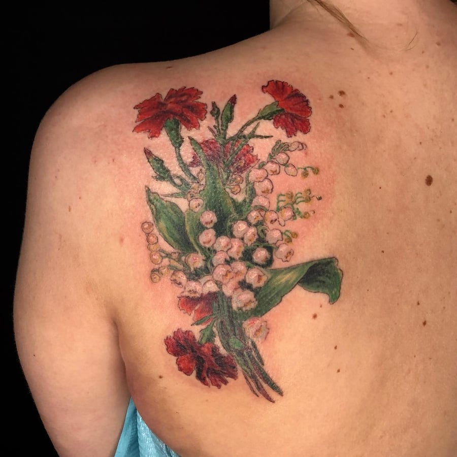 A realistic color flower bouquet tattoo on the shoulder, featuring delicate floral details and vibrant colors — by Sandra Price, los angeles