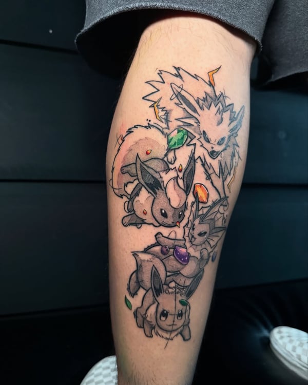 A colorful tattoo of a group of anime creatures on the leg, featuring a mix of colors and illustrative style — by zealous, los angeles