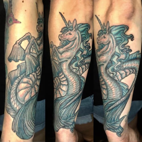 A colorful unicorn seahorse tattoo on the forearm, done in a neo-traditional illustrative style with ornate details — by Sandra Price, los angeles