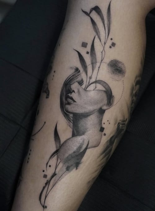 A surrealistic black and grey tattoo of a woman's face with abstract elements on the leg, featuring intricate linework and shading — by Jian Liang, los angeles