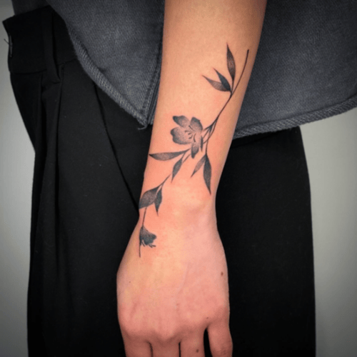 fine line flower branch tattoo — by Samantha Wilks, los angeles