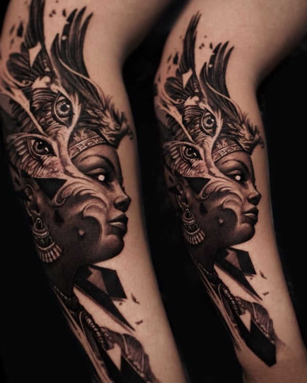 A surreal black and grey portrait of a woman's face with ornate and eye motifs on the forearm — by Vladimir Kozachenko, los angeles