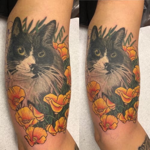 A realistic color tattoo of a cat surrounded by yellow flowers on the forearm — by Sandra Price, los angeles