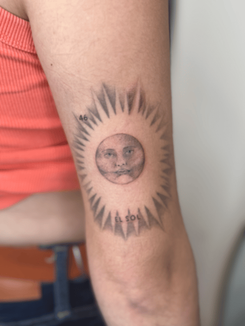 black & grey sun with face tattoo — by Samantha Wilks, los angeles